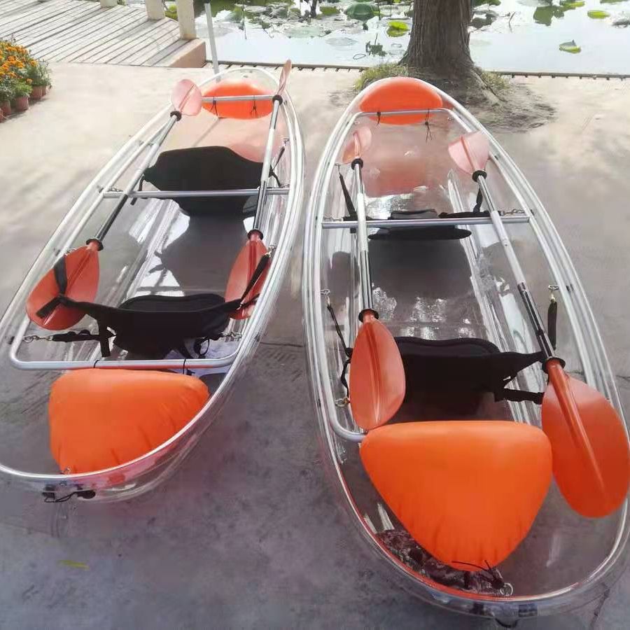 Clear kayak raft 2 orange paddles